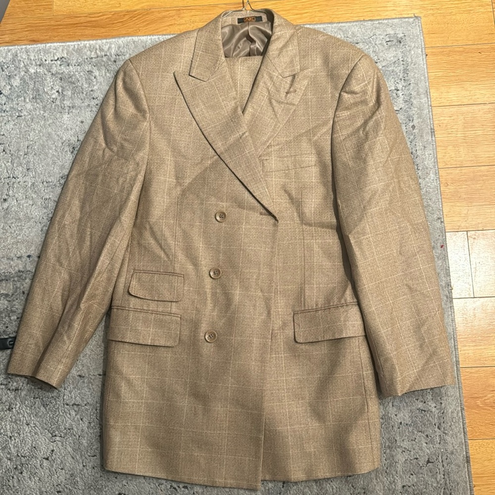 This is a 2 piece 100% wool suit in a size 40R/34.
